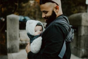 Dad holding a baby