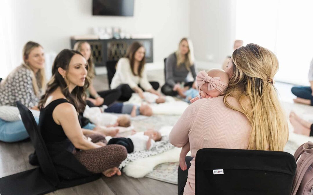 A group of New Moms with their newborns at the New Mom School