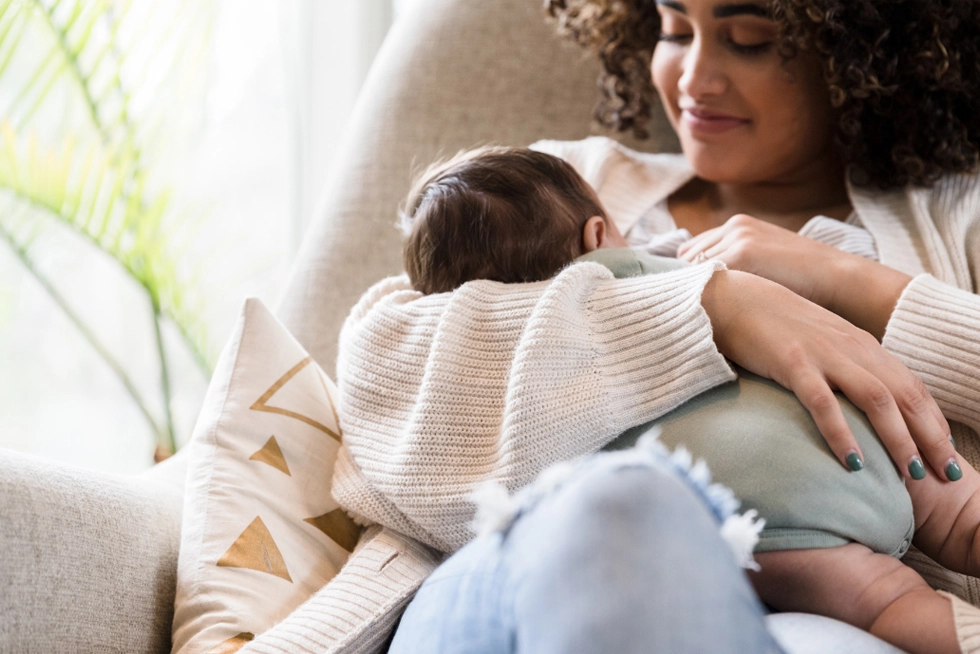 Certified lactation consultant helping mom breastfeed her newborn in Greenville, SC.