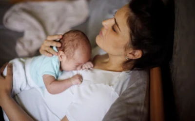 Understanding Postpartum Depression: Signs, Causes, and Real Mom Stories Co-authored by New Mom School & Evolving Mothers