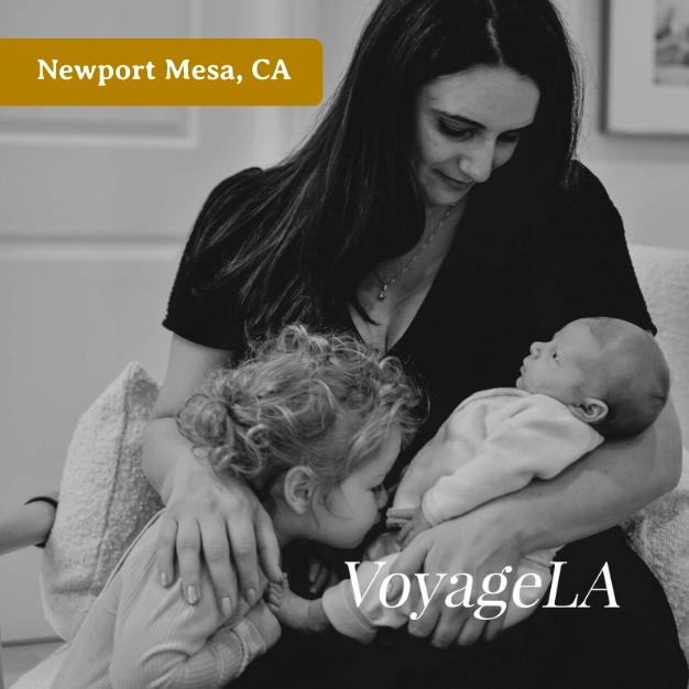Rebecca Kushner of New Mom School Newport Mesa holding her children, featured in VoyageLA.