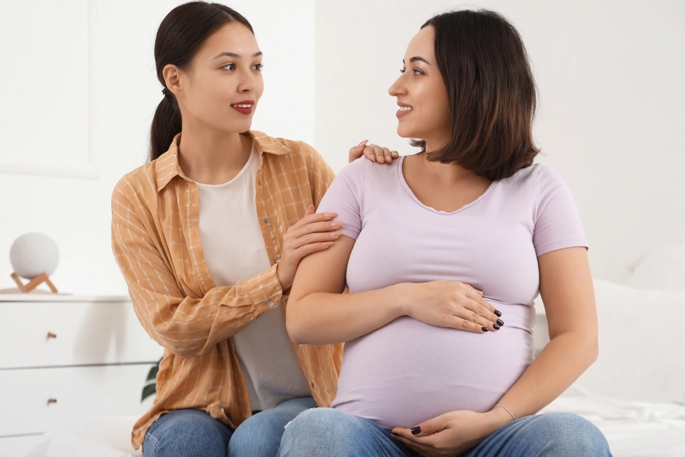 Postpartum doula providing emotional support to an expecting mother in Houston Greater Heights, Texas.