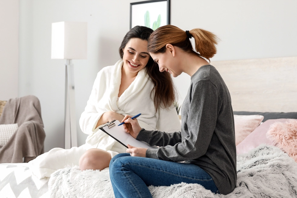 Postpartum doula supporting a new mother and baby during early postpartum recovery in Katy, Texas.